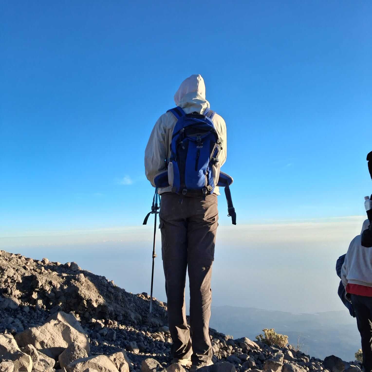 Climbers crossing Sembalun savanna towards Mount Rinjani summit